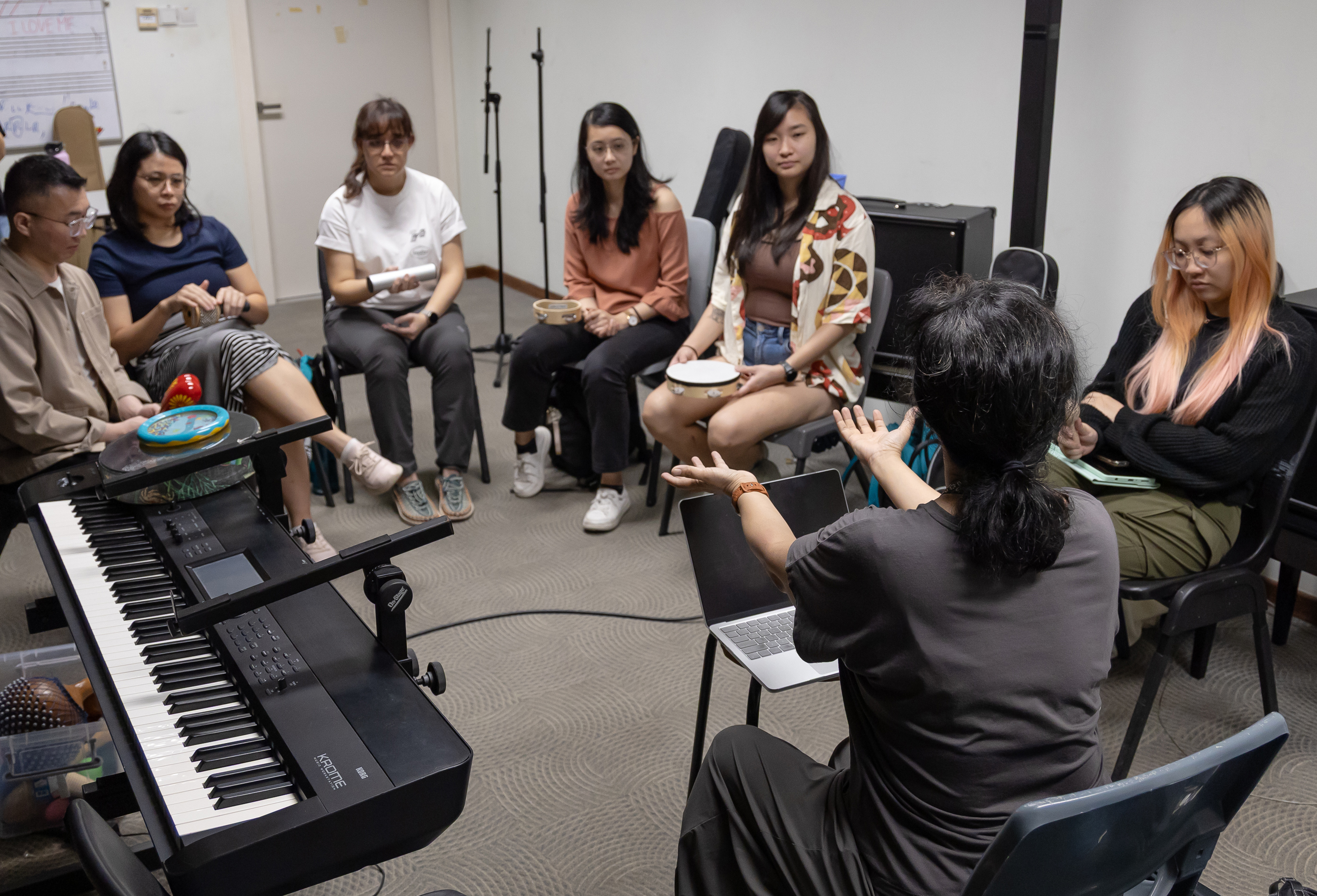 MA Music Therapy Programme Leader Dr Indra (foreground on the right) teaching a class at LASALLE.