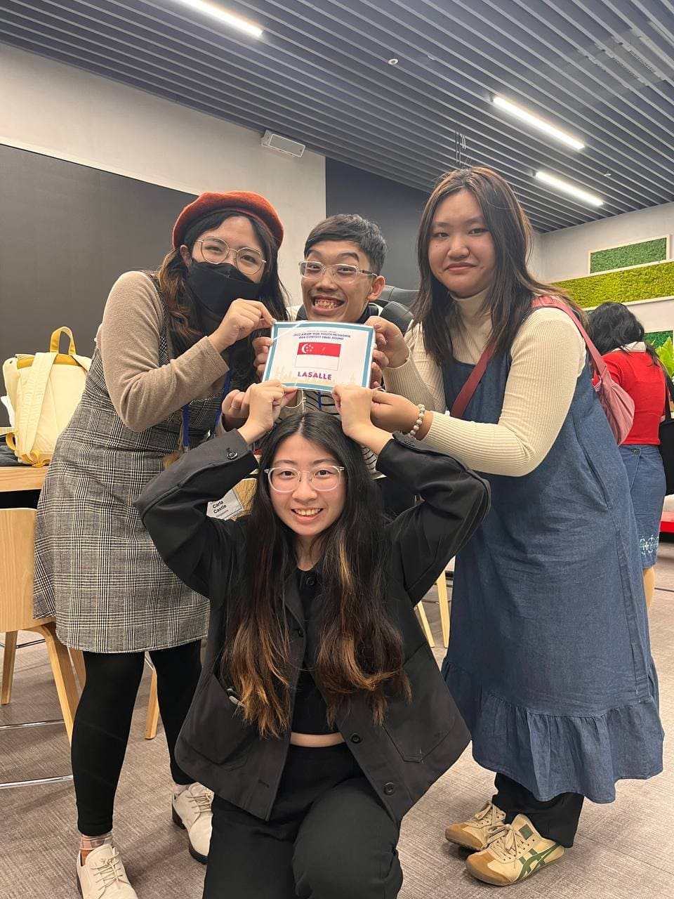 (Clockwise from left) Carla, Lionel, Angelina and Yanbing proudly displaying their finalist tag.