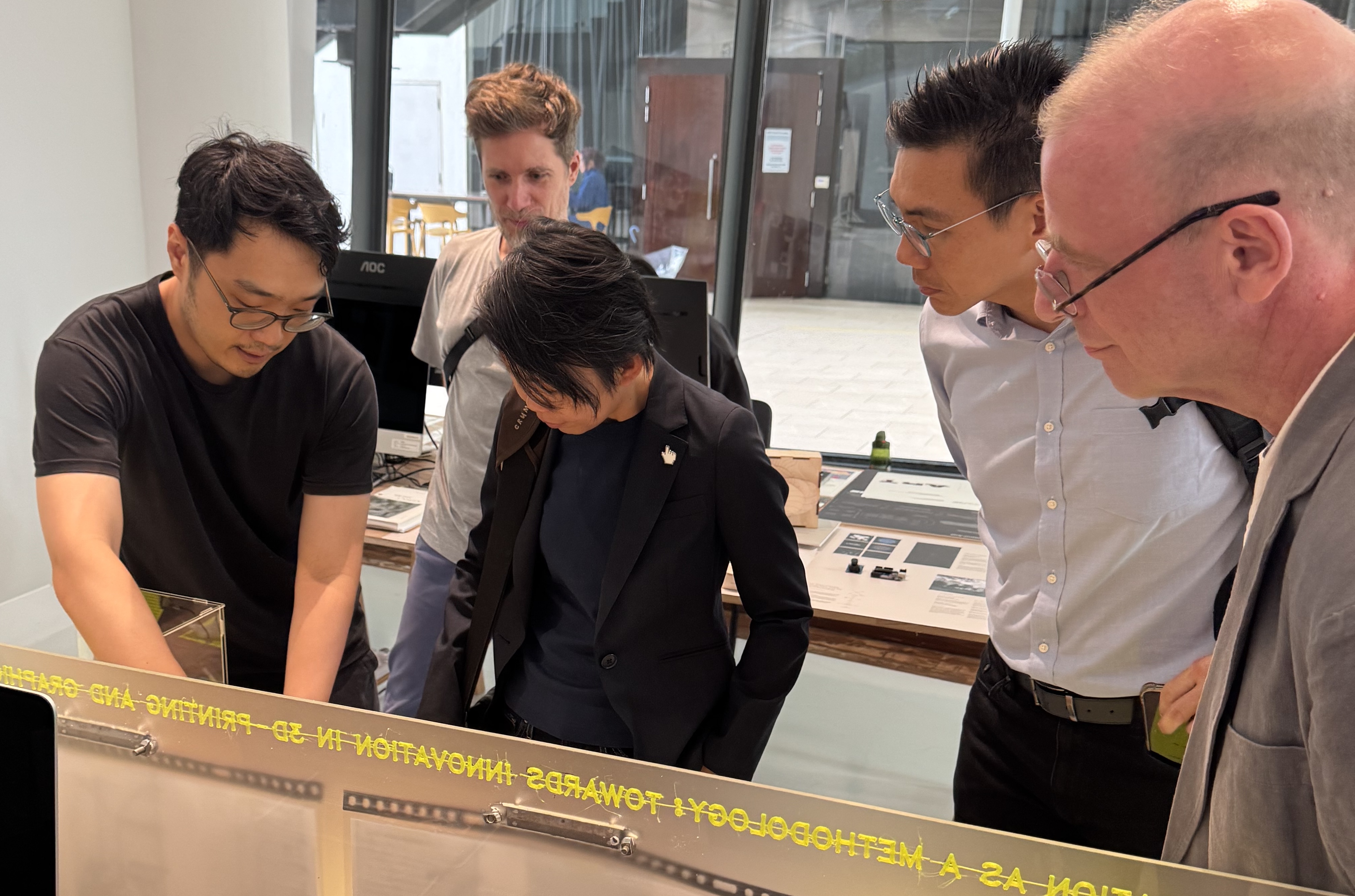 (First from left) Darius Ou explains his prototypes to visitors at the MA Design work in progress show Interludes earlier in May 2025.