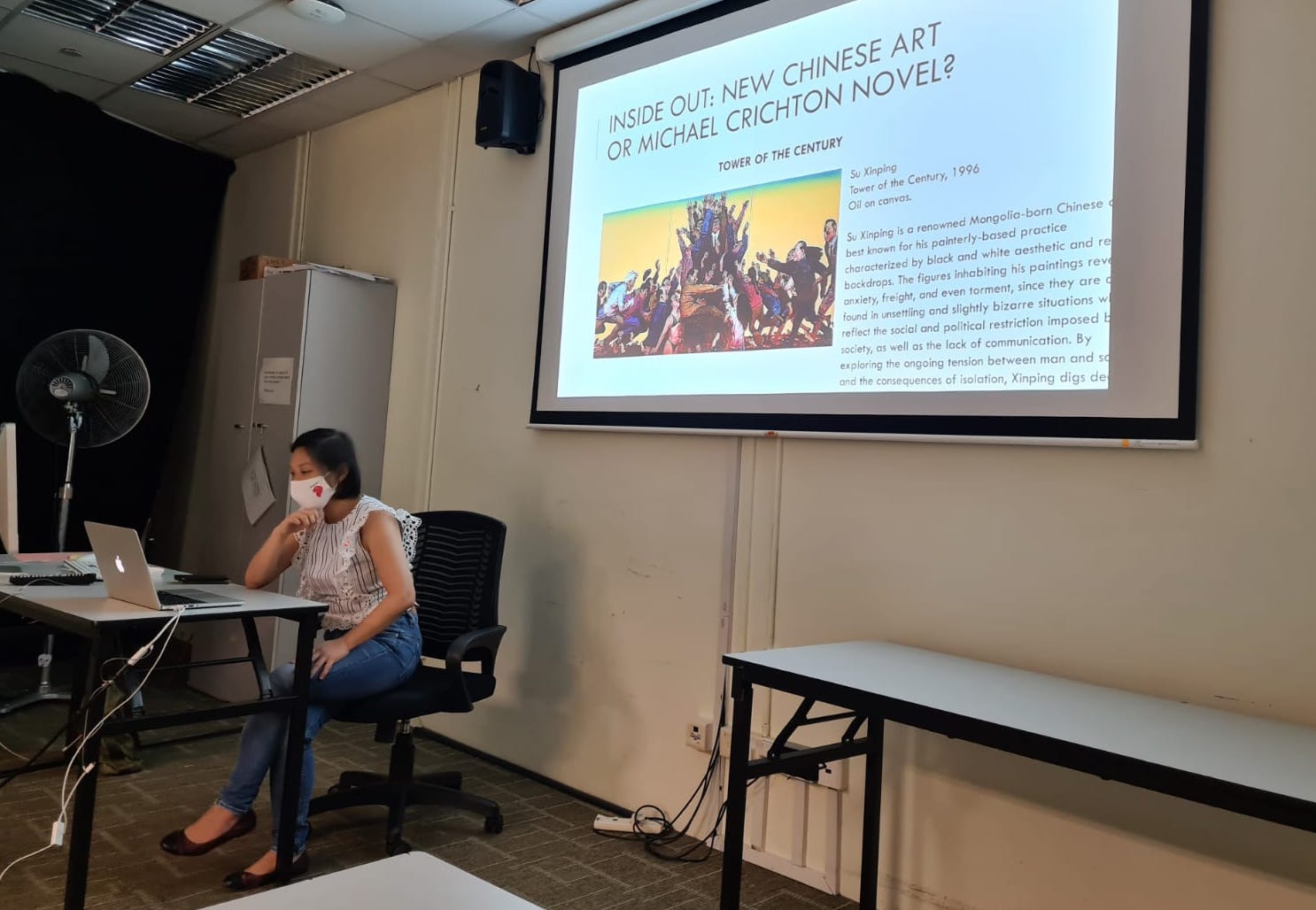 Vanessa doing a class presentation on Chinese art during her studies.
