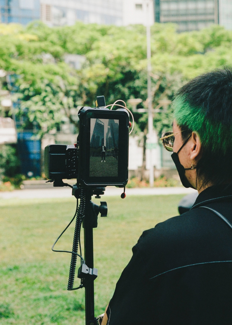 Student Joseph Poh monitors the shoot