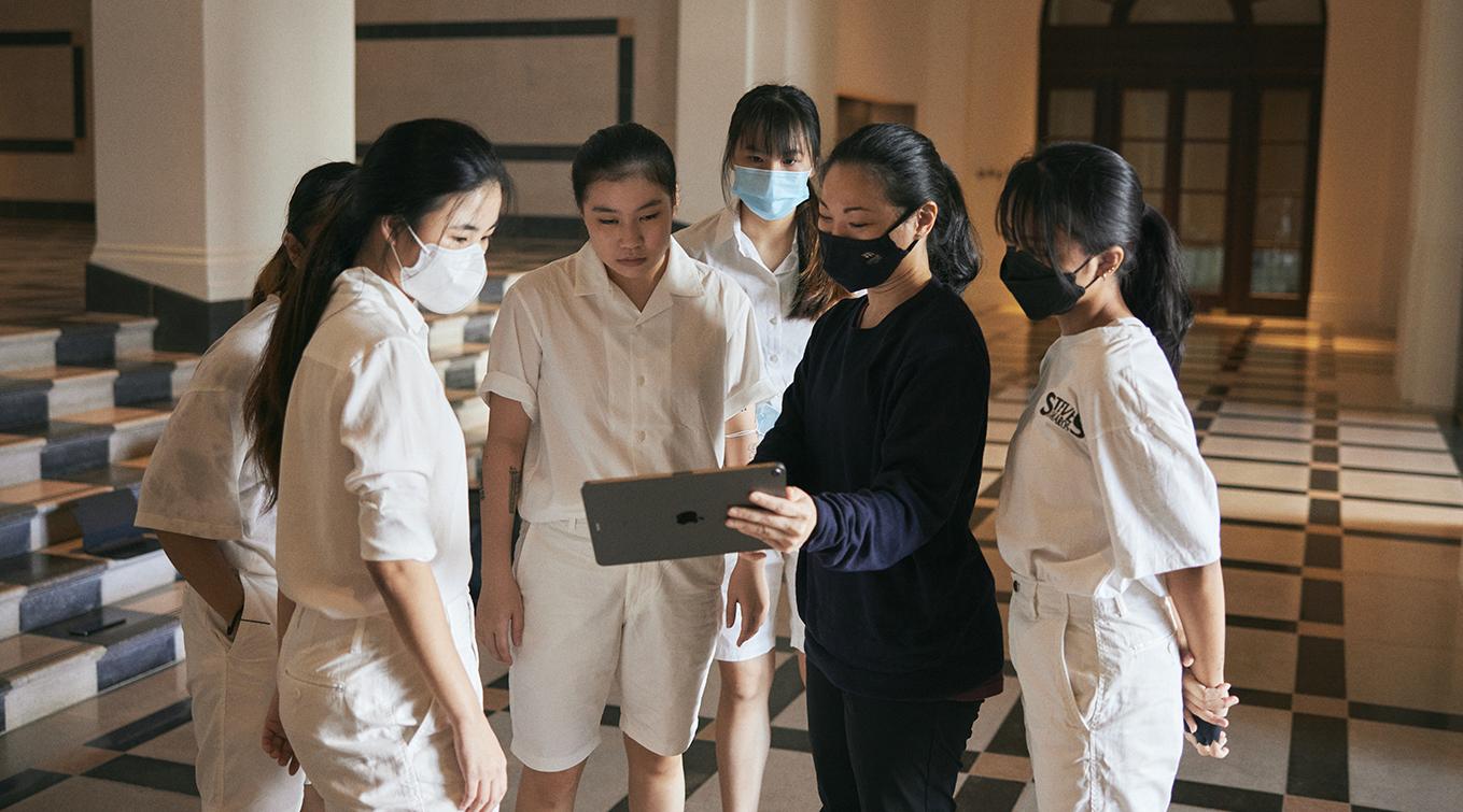 Choreographer Dapheny Chen monitors a performance with students at the National Gallery Singapore.