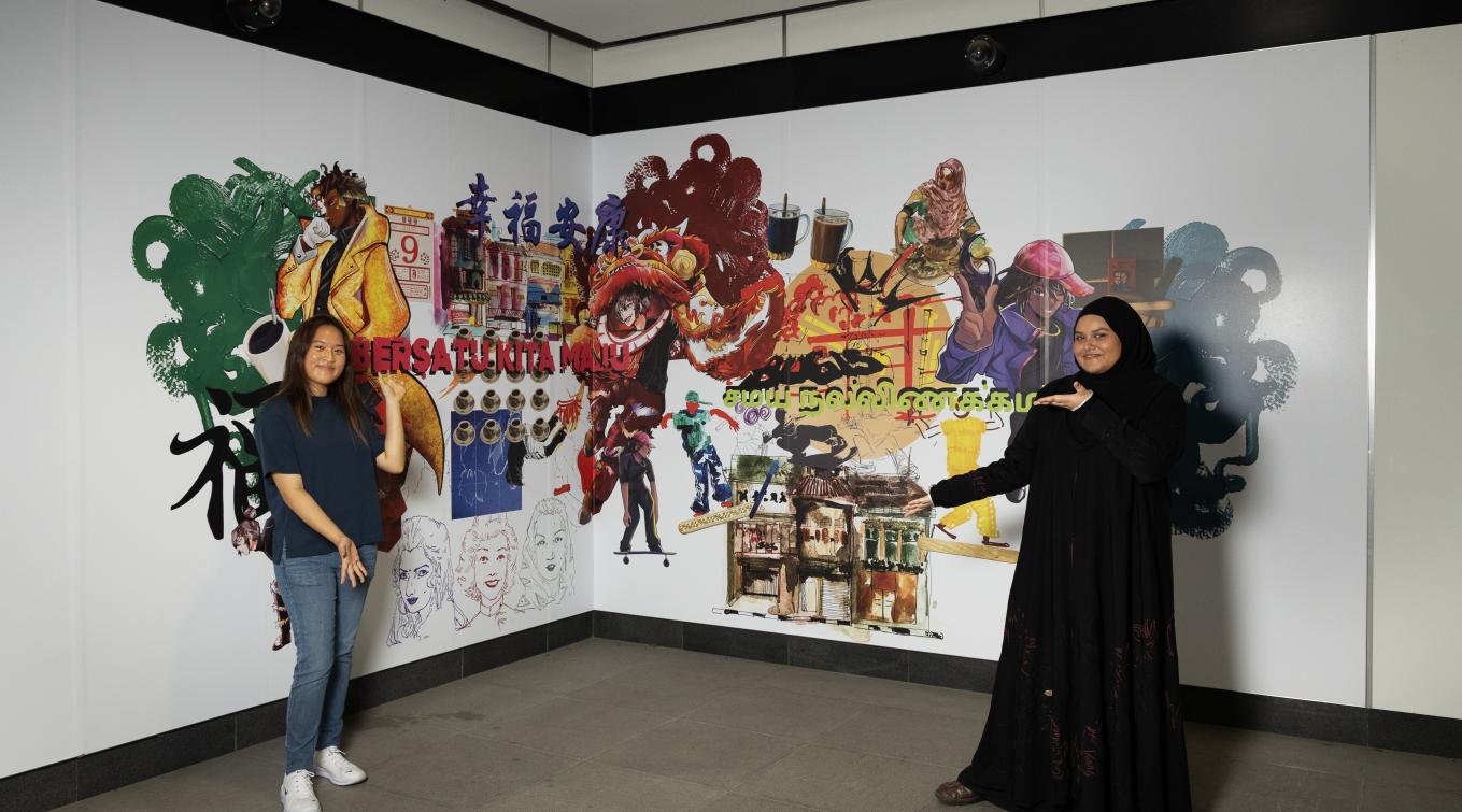 Tiara Choo and Ayra Nasha pose in front of their art at Rochor MRT station.