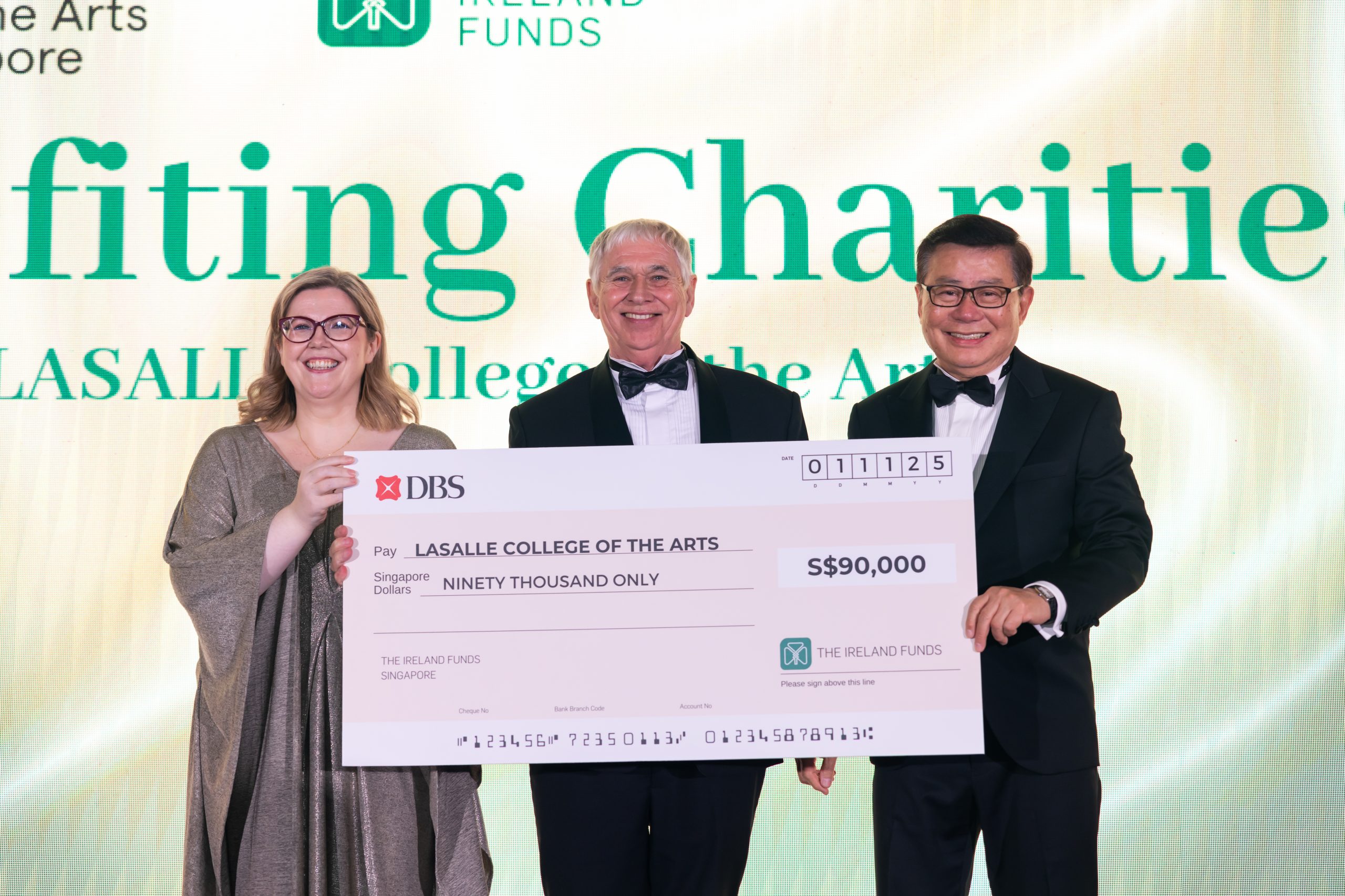 Irish Ambassador Sarah McGrath presents a cheque to LASALLE President Steve Dixon at the Emerald Ball 2025