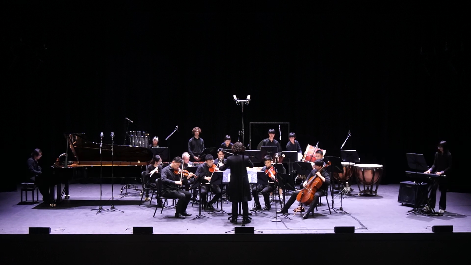 Ngiam conducting the chamber orchestra for his graduate recital.