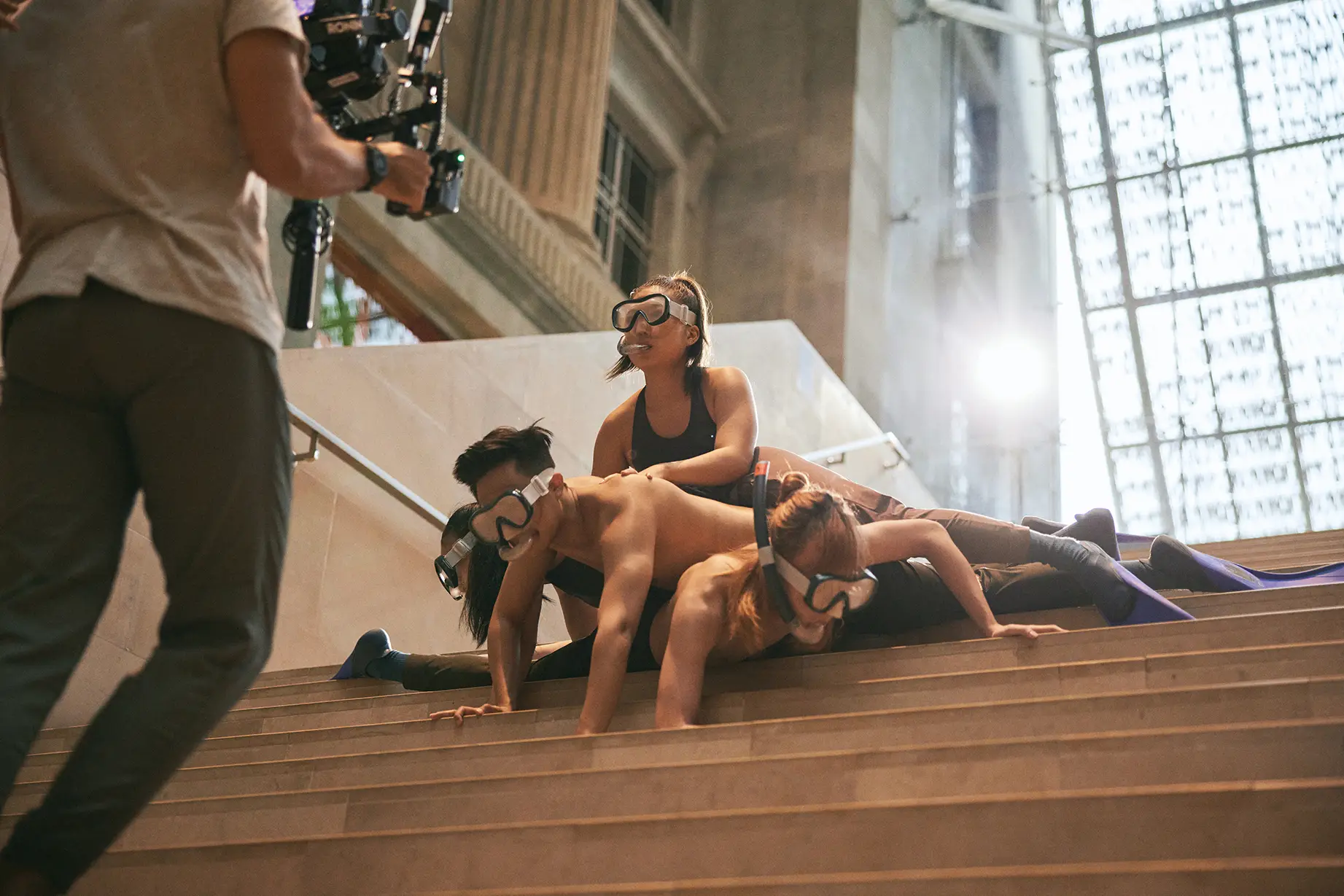 Students wear snorkels as the move on the steps of the National Gallery