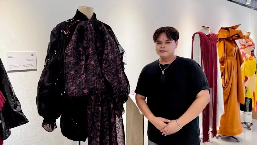 Ahmad Hanif Bin Ahmad Jamal with his designs on display at The LASALLE Show Exhibition at the McNally campus of LASALLE College of the Arts (Photo: Fatyn Abdul Samad)